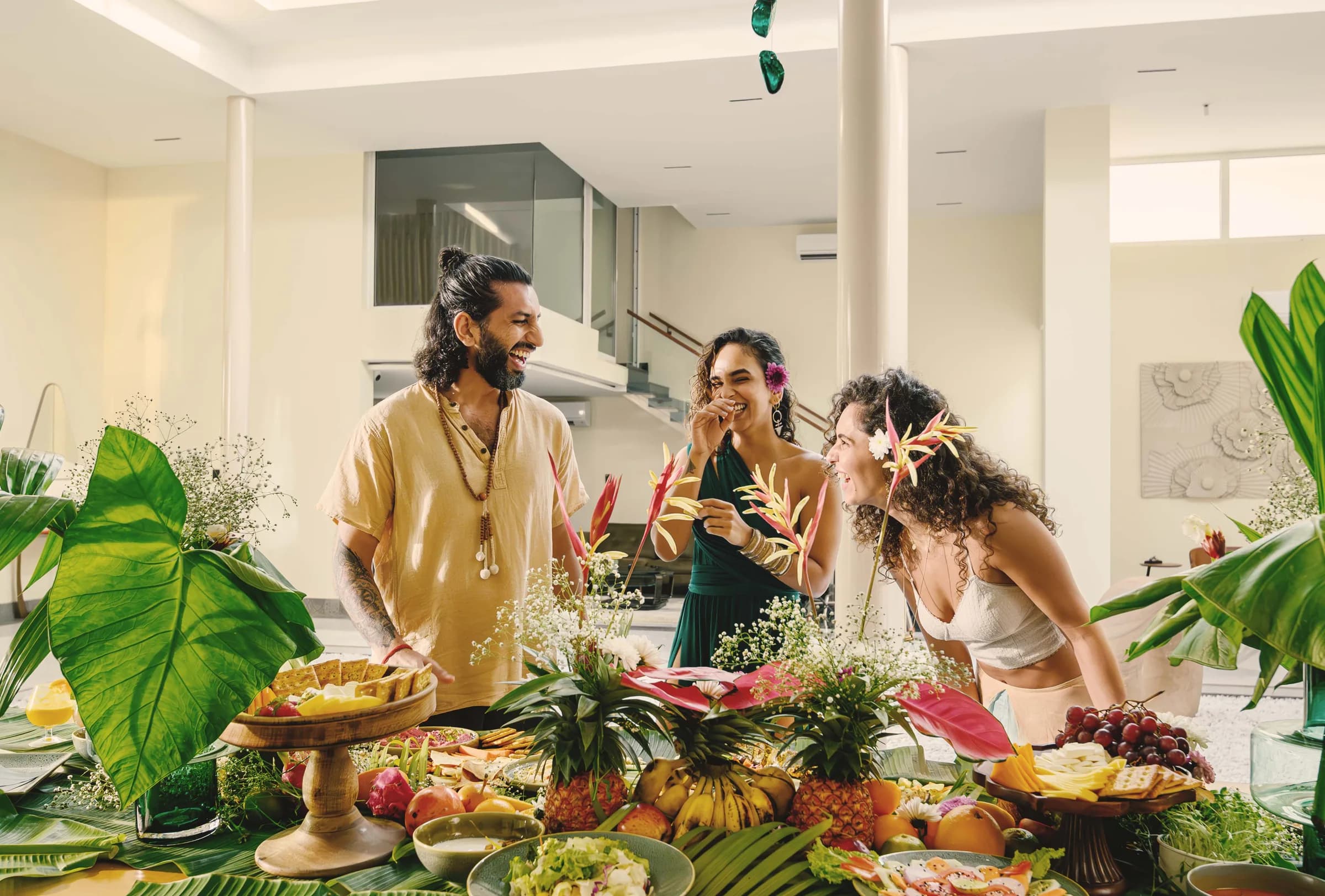 Fruit and flowers arranged across a shared dining table