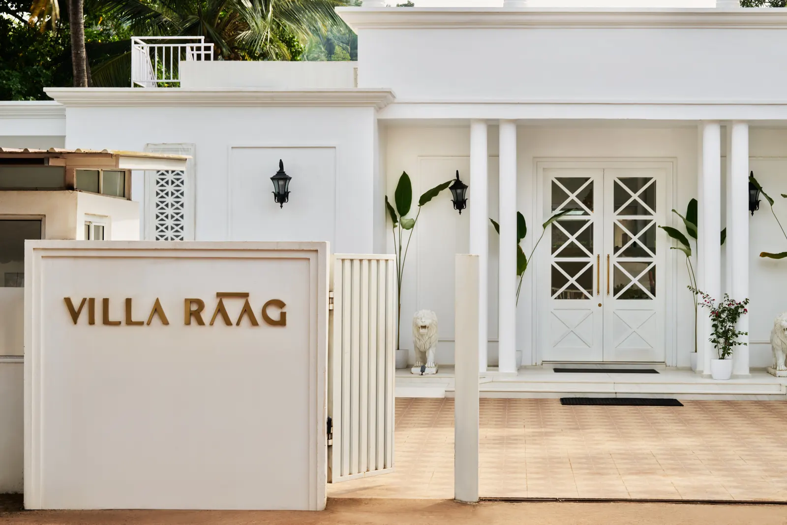 Villa Raag’s entrance, with its gold name and white doors